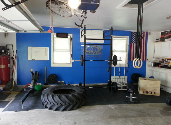 Nice and simple, clean garage gym with yet another giant tire!