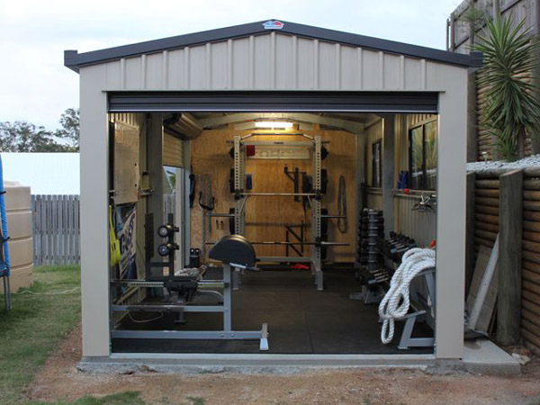 This is a nice shed garage gym - power rack, dumbbells, GHD, even a 