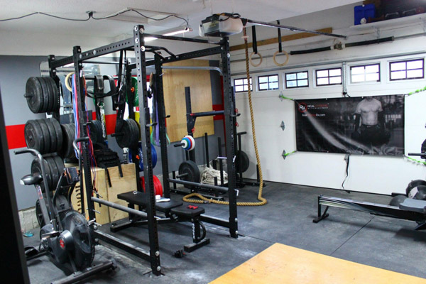 This is a pretty hardcore garage gym. I'm sure this dude needs more bumper plates