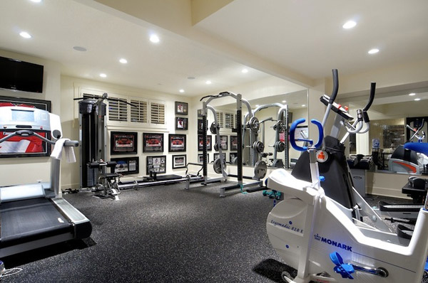 Big home gym with futuristic looking cardio machines