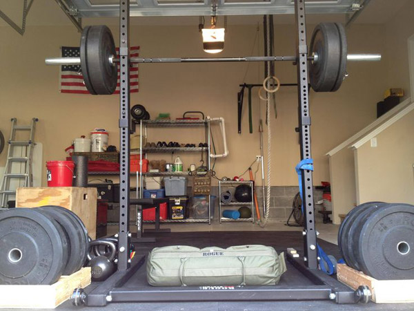Bumper plates, sand bags, squat stand.. great gym