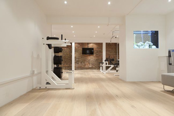 Nice spacious home gym with wood floors. Not sure if this is private residence or not. Still very nice
