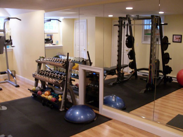 Fancy home gym - check out the mini fridge with water built into the wall. pretty cool