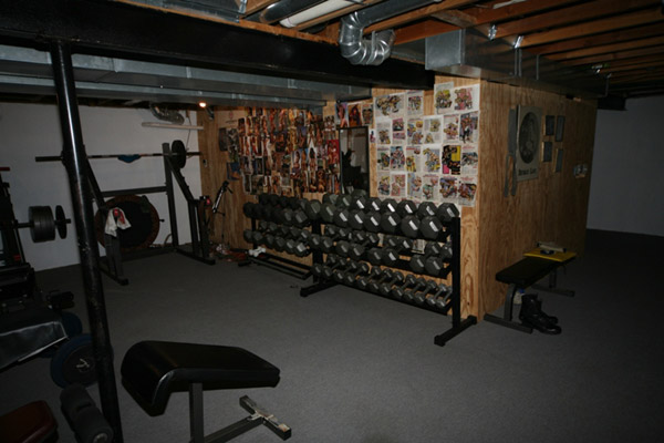 This dark and gloomy basement gym has a hell of a dumbbell collection