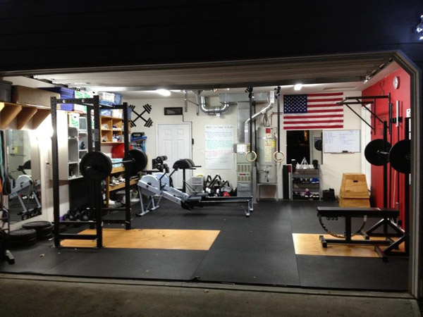 Some dude named Tim has a very well designed and set up garage gym with two rowers, a rack, bench, great flooring, and it's very organized. Very impressed