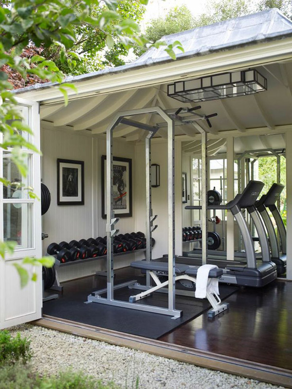 Outdoor garage gym with really cool door for feeling like you're working out outside