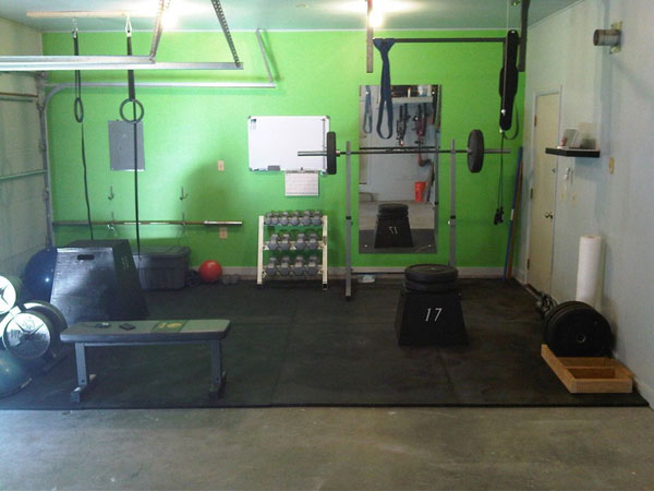 Basic CrossFit garage gym. Does that bar on the wall look bent? #garagegym
