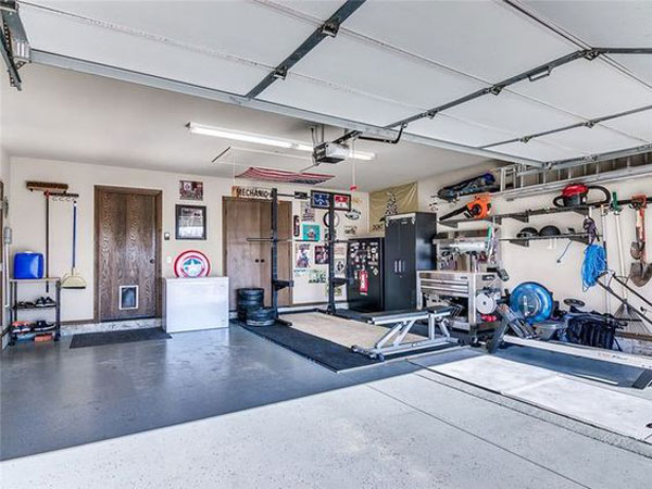 Excellent garage gym. Squat stand, platform, lots of space, and still room for the car