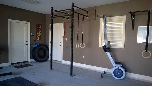 Wall mounted rack, Concept2 rower, tire, and weights somewhere, right? Nice CrossFit set up