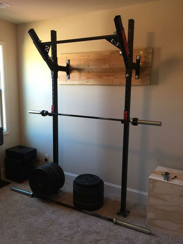 Bedroom gym equipped with HI-Temps and the Slim Gym wall rack
