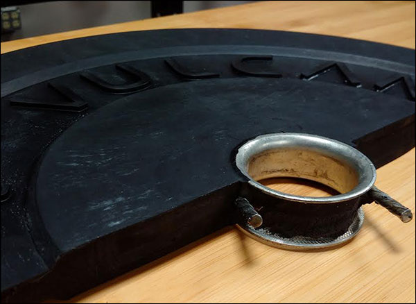 Cross section of a Vulcan 10-lb bumper plate, featuring their exclusive hooked insert