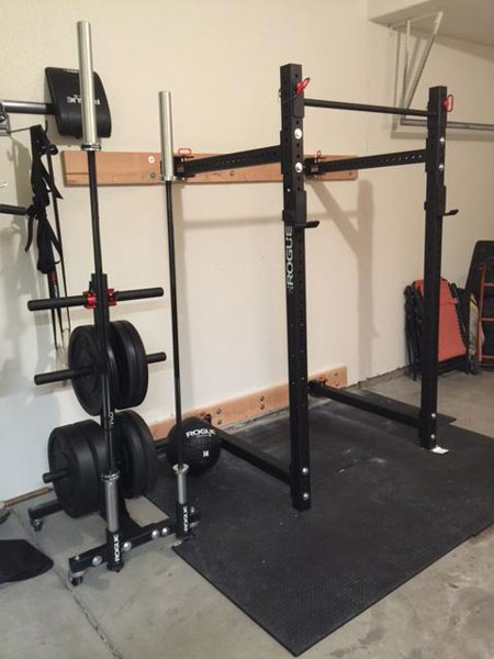 Rogue-equipped garage gym with folding power rack - Garage Gyms