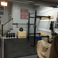 Fully equipped garage gym with space for the car