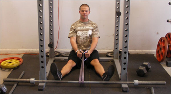 Seated Resistance Band Rows inside a Power Rack