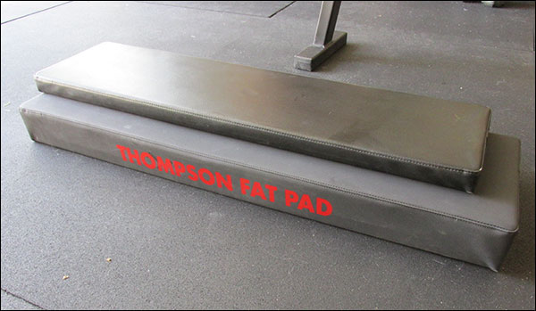 Size difference between Thompson Fat Pad and standard 12" x 48" bench pad (from Rogue Utility)