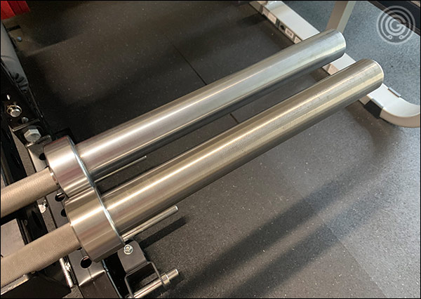 The American Barbell Elite Power Bar's chrome sleeves (top) vs the Deep Knurl Power Bar EX's stainless sleeves